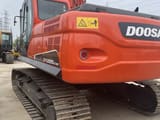 2022 Doosan DX225LC-9C crawler excavator rear three-quarter view