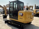 2023 Caterpillar 305.5E mini excavator, rear three-quarter view
