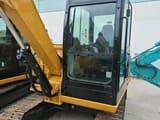 2022 Caterpillar 305.5E2 crawler excavator cab and boom view