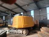 2011 Caterpillar 324E crawler excavator, rear three-quarter view
