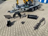 Berger Kraus BK1250JS mini excavator on trailer with attachments