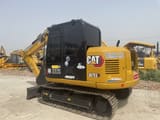 2024 Caterpillar 307E2 mini excavator, rear three-quarter view