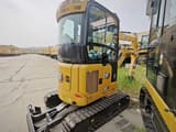 2026 Caterpillar 302CR mini excavator, front three-quarter view