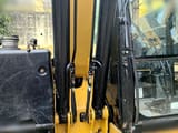 2019 Caterpillar 310 crawler excavator boom and cab detail