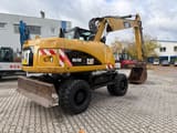2010 Caterpillar M316D wheel excavator, rear three-quarter view