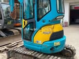 Kubota U25S mini excavator, rear three-quarter view