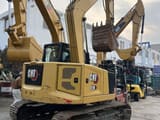2019 Caterpillar 310 crawler excavator, rear three-quarter view