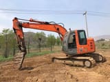 2023 Hitachi ZX135US-6 crawler excavator, side profile view