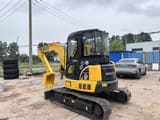 2024 Komatsu PC-55MR mini excavator, rear three-quarter view