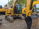 Caterpillar 307E mini excavator, front three-quarter view