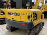 2023 Komatsu PC56-7 mini excavator, rear three-quarter view