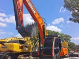 2024 Doosan DX225LCA crawler excavator, front three-quarter view