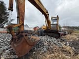 1985 Mitsubishi MS120-2 excavator, front three-quarter view