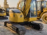 2023 Komatsu PC78US excavator, rear three-quarter view