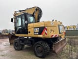 2013 Caterpillar M316D wheel excavator, rear three-quarter view