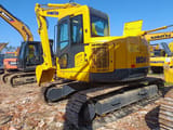 2023 Komatsu PC138US crawler excavator, rear three-quarter view