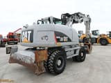 2009 Caterpillar M313D wheel excavator, rear three-quarter view