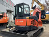 2024 Hitachi ZX50U mini excavator, rear three-quarter view