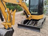 2023 Caterpillar 303.5E mini excavator, front three-quarter view