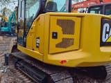 2025 Caterpillar 307.5 crawler excavator, rear three-quarter view