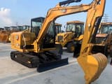 2023 Caterpillar 306E2 mini excavator, three-quarter view
