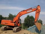 2022 Doosan DX225LC crawler excavator, side profile view