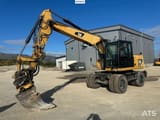2012 Caterpillar M313D wheel excavator, side view