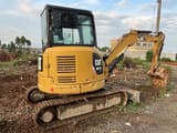 2019 Caterpillar 303.5E mini excavator, rear three-quarter view