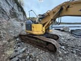 2005 Komatsu PC228USLC-3 crawler excavator, rear three-quarter view