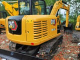 2024 Caterpillar 305.5E2 mini excavator, rear three-quarter view