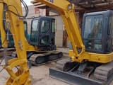 Komatsu PC50MR mini excavator, front three-quarter view