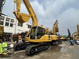 2025 Komatsu PC220-7 crawler excavator, front three-quarter view