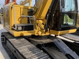 Caterpillar 308E2 mini excavator, rear three-quarter view