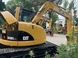 Caterpillar 308C CR crawler excavator, rear three-quarter view