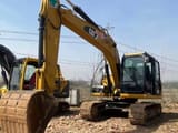 2023 Caterpillar 313D2 crawler excavator, front three-quarter view