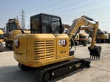 2023 Caterpillar 305.5E mini excavator, rear three-quarter view