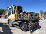 2010 Liebherr A316 wheel excavator, rear three-quarter view