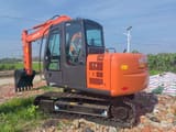 2025 Hitachi ZX60 mini excavator, rear three-quarter view