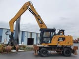 2018 Caterpillar MH3024 material handler side view