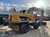 2008 Caterpillar M318D wheel excavator, rear three-quarter view