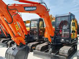 2024 Doosan DH55 mini excavator, front three-quarter view