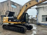 2022 Caterpillar 325BL crawler excavator, side view