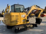 2023 Caterpillar 305.5E2 mini excavator, rear three-quarter view