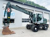 2009 New Holland MH-PLUS wheel excavator, side profile view