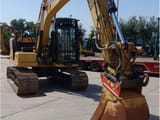 2021 Caterpillar 313-07GC crawler excavator, front three-quarter view