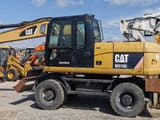2011 Caterpillar M315D wheel excavator, side profile view