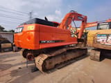 2024 Doosan DX300LC crawler excavator, rear three-quarter view