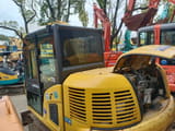 2013 Komatsu PC70 mini excavator, rear three-quarter view