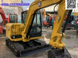 2024 Caterpillar 305.5E2 mini excavator, front three-quarter view