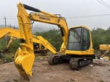 2025 Komatsu PC60 mini excavator, front three-quarter view